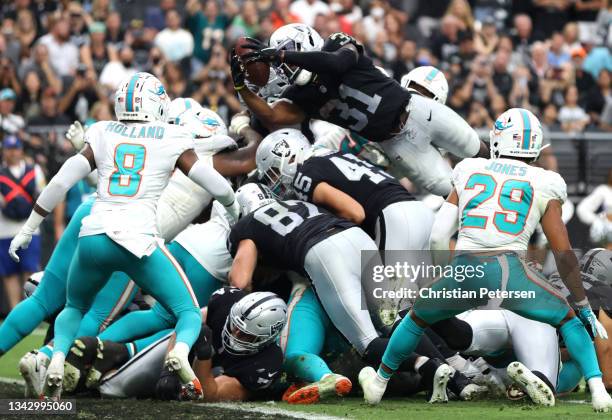 Peyton Barber of the Las Vegas Raiders scores on a rushing touchdown against the Miami Dolphins in the fourth quarter of the game at Allegiant...