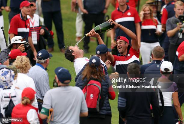 Tony Finau of team United States celebrates with champagne after defeating team Europe to win the 43rd Ryder Cup at Whistling Straits on September...