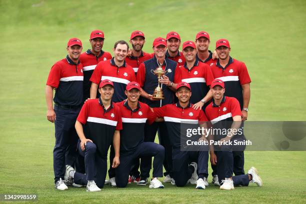 Team United States celebrates with the Ryder Cup after defeat Team Europe 19 to 9 during Sunday Singles Matches of the 43rd Ryder Cup at Whistling...