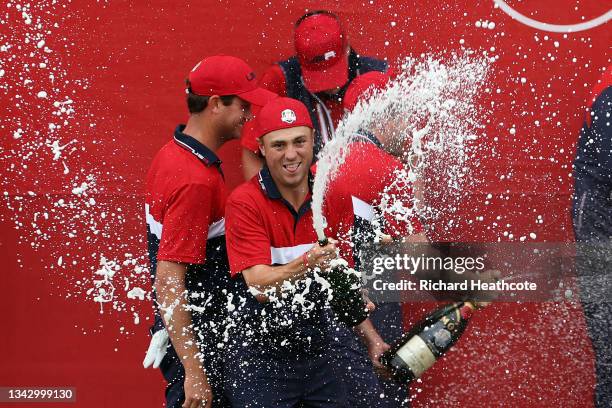 Justin Thomas of team United States celebrates with champagne after defeating team Europe during Sunday Singles Matches of the 43rd Ryder Cup at...