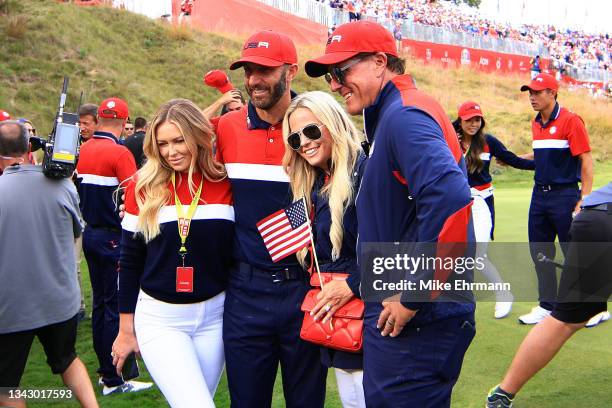 Dustin Johnson of team United States, partner Paulina Gretzky, vice-captain Phil Mickelson of team United States and wife Amy Mickelson celebrate...