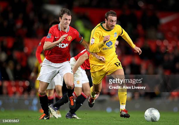 Glenn Murray of Crystal Palace competes with Jonny Evans of Manchester United during the Carling Cup Quarter Final match between Manchester United...