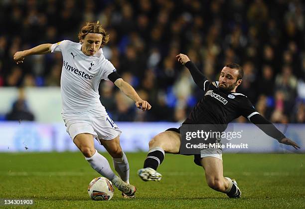 Dimitris Salpingidis of PAOK FC tackles Luka Modric of Spurs during the UEFA Europa League Group A between Tottenham Hotspur and PAOK Salonika match...