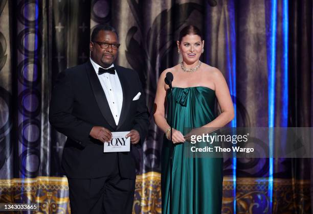 Wendell Pierce and Debra Messing speak onstage during the 74th Annual Tony Awards at Winter Garden Theatre on September 26, 2021 in New York City.