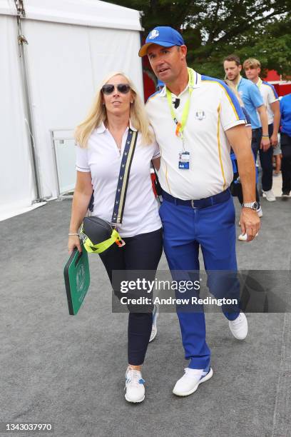 Captain Padraig Harrington of Ireland and team Europe walks with his wife Caroline Harrington after their 19 to 9 loss to Team United States during...