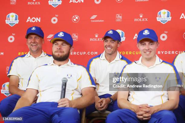 Ian Poulter of England and team Europe, Tyrrell Hatton of England and team Europe, Rory McIlroy of Northern Ireland and team Europe and Matthew...