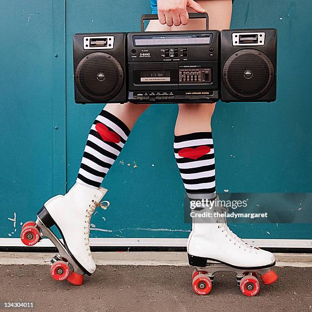 legs of woman wearing white roller skates - rolschaatsen schaats stockfoto's en -beelden