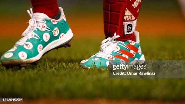 Catcher Enrique Hernandez of the Boston Red Sox wears Adidas cleats adorned with retired player numbers during the game against the New York Yankees...