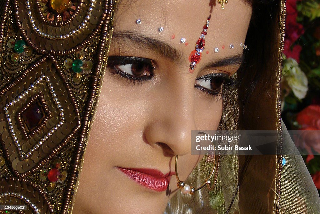 Portrait of bride wearing traditional nose ring