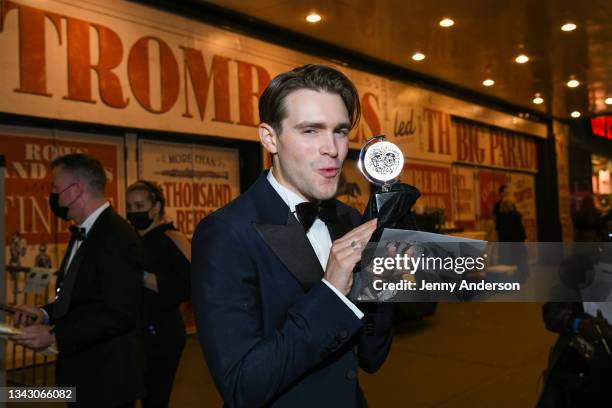 Andrew Burnap, winner of the award for Best Performance by an Actor in a Leading Role in a Play for "The Inheritance" poses outside during the 74th...