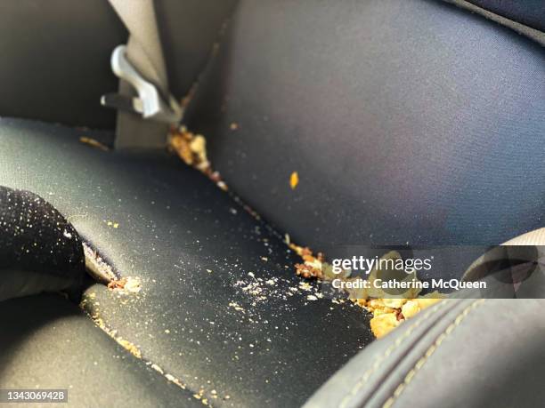 time to clean toddler’s car safety seat - dirty car stockfoto's en -beelden