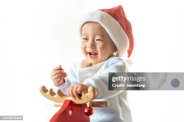 baby - santa leaning stock pictures, royalty-free photos & images