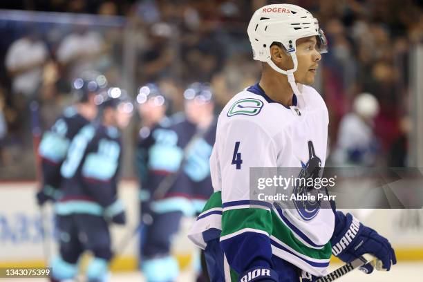 Madison Bowey of the Vancouver Canucks skates after a goal by Morgan Geekie of the Seattle Kraken to add to the 5-3 lead in the third period during a...