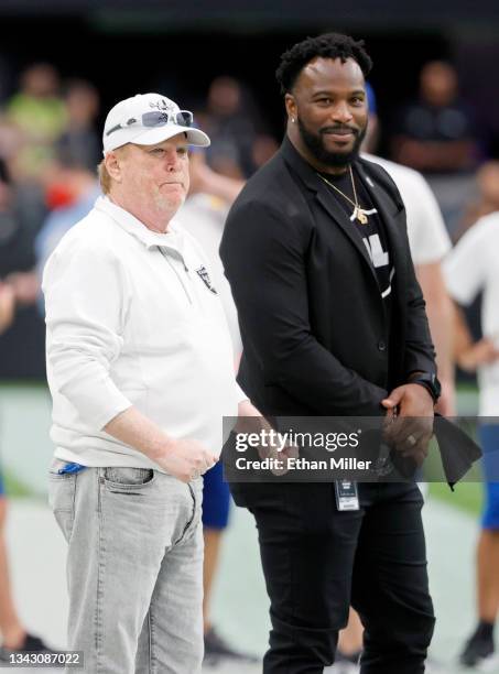 Las Vegas Raiders owner and managing general partner Mark Davis and former player and senior advisor to the owner and president Marcel Reece watch...