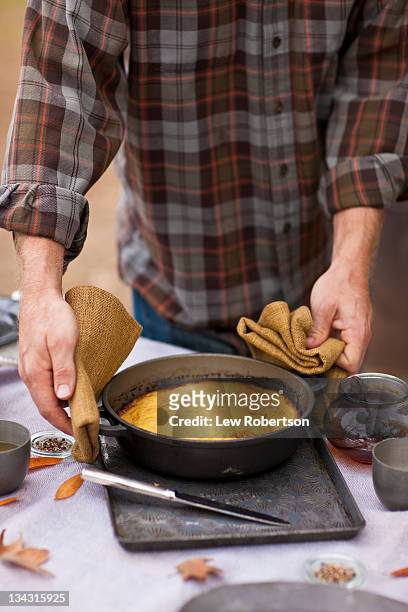 man serving cornbread - cornbread stock pictures, royalty-free photos & images