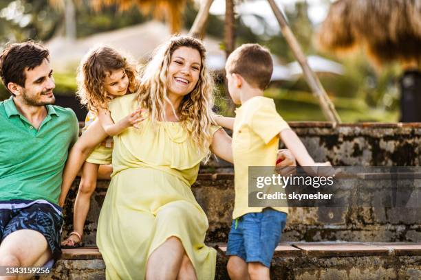 happy pregnant woman enjoying with her family in nature. - kids fun indonesia stock pictures, royalty-free photos & images