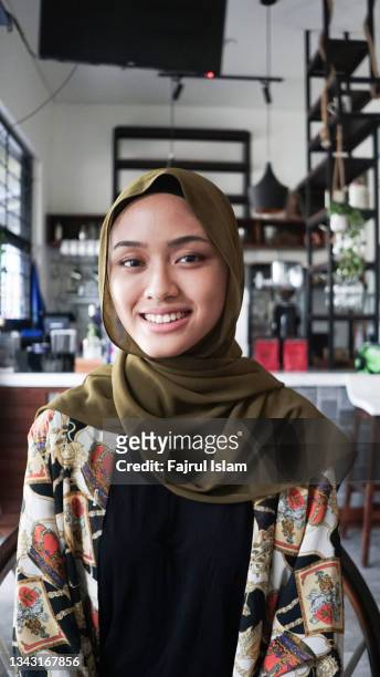 indonesia happy women hijab - indonesia business stock pictures, royalty-free photos & images