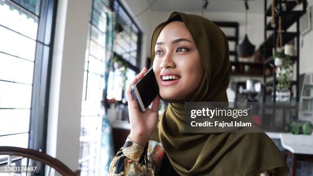 muslim women working at cafe - indonesia independence stock pictures, royalty-free photos & images