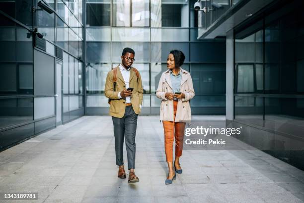 going home after work - two people talking outside stock pictures, royalty-free photos & images