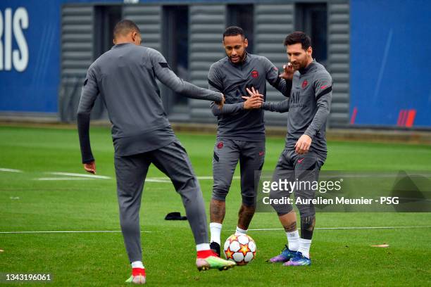 Leo Messi, Neymar Jr and Kylian Mbappe in action during a Paris Saint-Germain training session at Ooredoo Center on September 27, 2021 in Paris,...