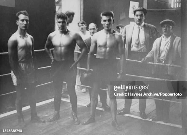 Argentinian welterweight boxer Hector Mendez , Argentinian light heavyweight boxer Arturo Rodriguez Jurado standing among unspecified people in a...