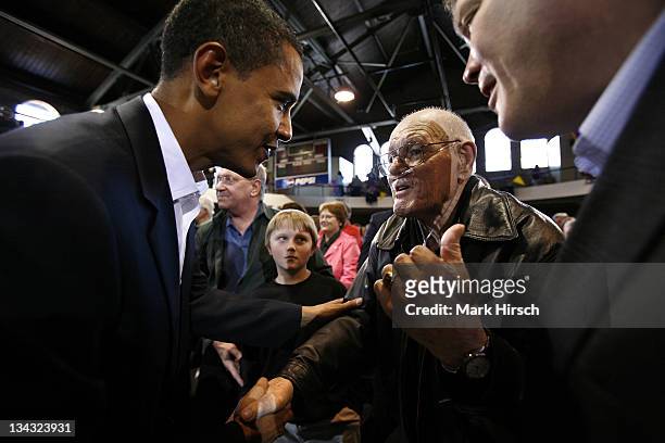 Illinois Senator and Democratic Presidential candidate Barack Obama talks with Edward Gaulrapp of Freeport, Il. During a campaign stop at the Loras...