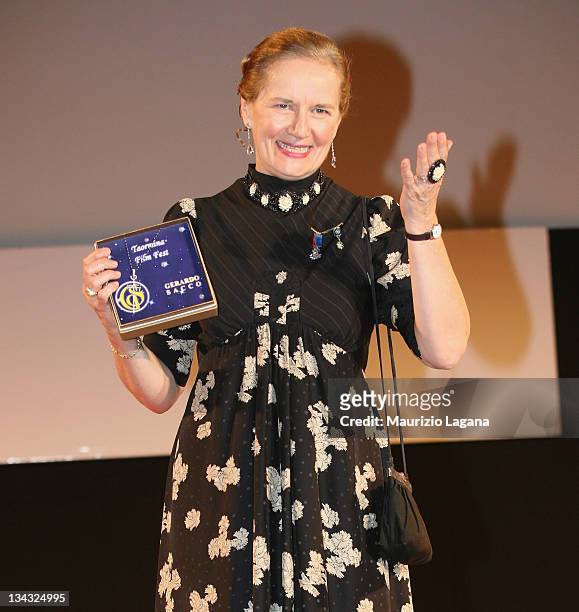 Dominique Sanda shows her Taormina Art Award during Taormina Film Festival at Greeece Theatre on June 18, 2009 in Taormina, Italy.