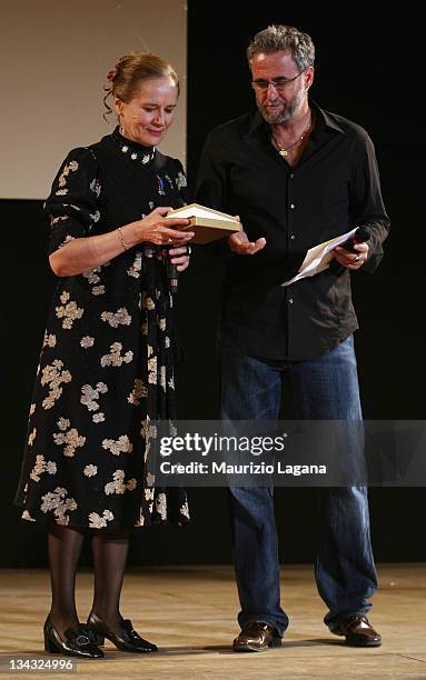 Dominique Sanda receives the Taormina Art Award from director Ari Folman during Taormina Film Festival at Greeece Theatre on June 18, 2009 in...