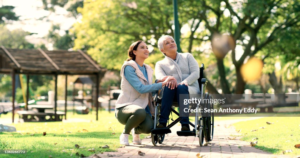 Shot of an elderly woman spending time with her daughter in a garden