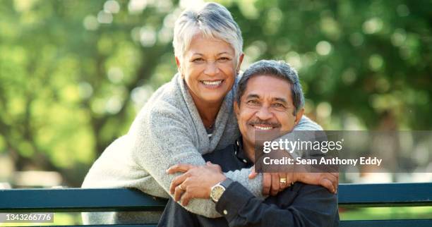 shot of an elderly couple spending time together in nature - retired couple stockfoto's en -beelden