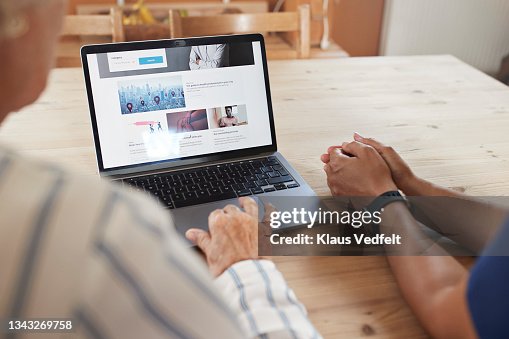 Woman learning to book appointment from caregiver Woman learning to book appointment from caregiver