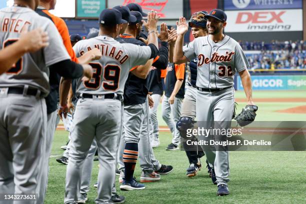 Michael Fulmer of the Detroit Tigers and his teammates high five after defeating the Tampa Bay Rays by a score of 4 to 3 at Tropicana Field on...