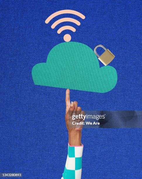 woman balancing online data security symbols on finger - bank fraud stockfoto's en -beelden