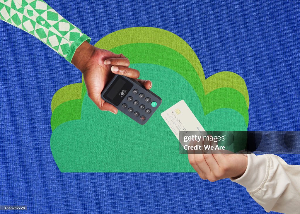 Hands making card payment with card reader