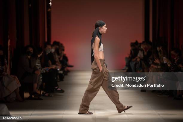 Model walks the runway during the Salvatore Ferragamo fashion show on the fourth day of Milan Fashion Week Women's collection Spring Summer 2022 on...