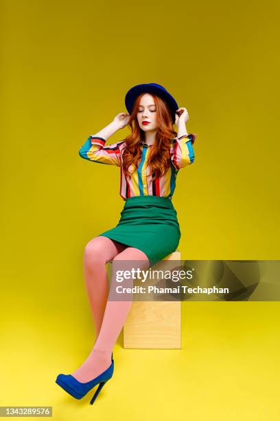 beautiful woman wearing colorful outfit - women wearing nylons photos et images de collection