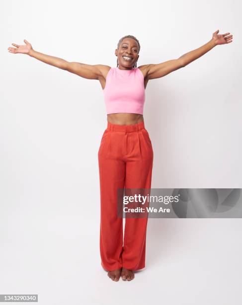 portrait of fit mature woman with arms outstretched - arms outstretched bildbanksfoton och bilder