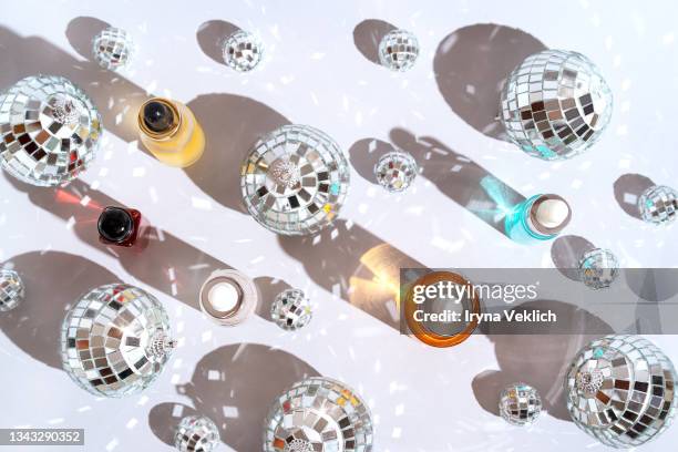 xmas present, gift, congratulation, beauty products.  winter holidays and black friday concept with silver disco balls and facial serum, natural essential oil, perfume. - build presents sensitive skin stock pictures, royalty-free photos & images