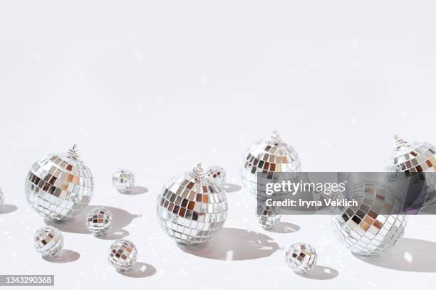 silver disco balls  on gray color background. merry christmas, happy new year invitation. - mirror ball background stock pictures, royalty-free photos & images