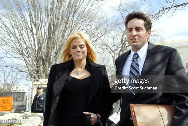 Former Playboy Playmate Anna Nicole Smith and her attorney Howard Stern leave the US Supreme Court in Washington, DC Tuesday afternoon after there...