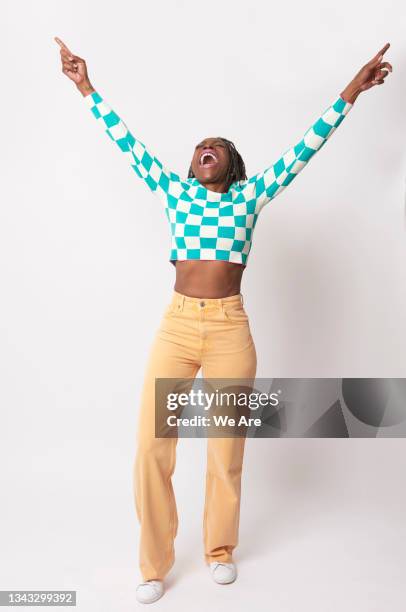 mature woman dancing  and being carefree with hands in the air - happy woman arms raised stock pictures, royalty-free photos & images