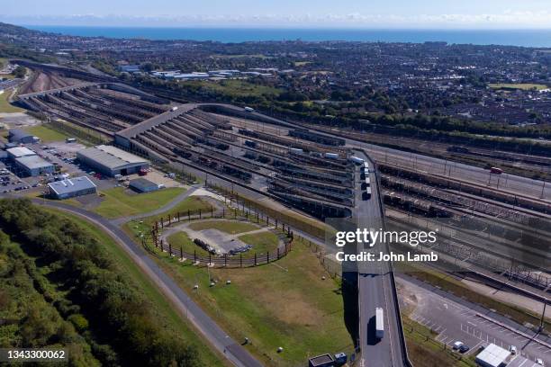 aerial view of lorries queuing to board the eurotunnel train at the folkestone terminal. - channel tunnel stock pictures, royalty-free photos & images