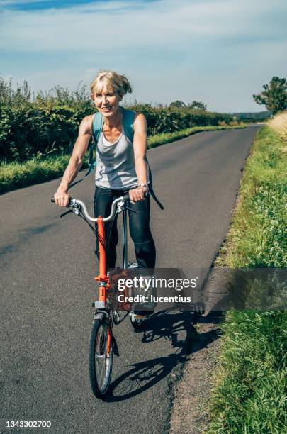 summer cycle in northern england - folding bike stockfoto's en -beelden