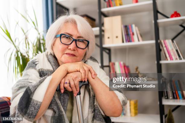 elderly woman looking pensive - retirement community staff stock pictures, royalty-free photos & images