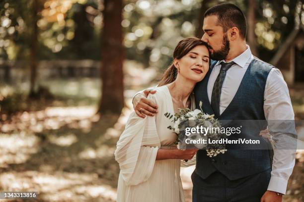 life feels perfect with you next me - wedding ceremony kiss stock pictures, royalty-free photos & images