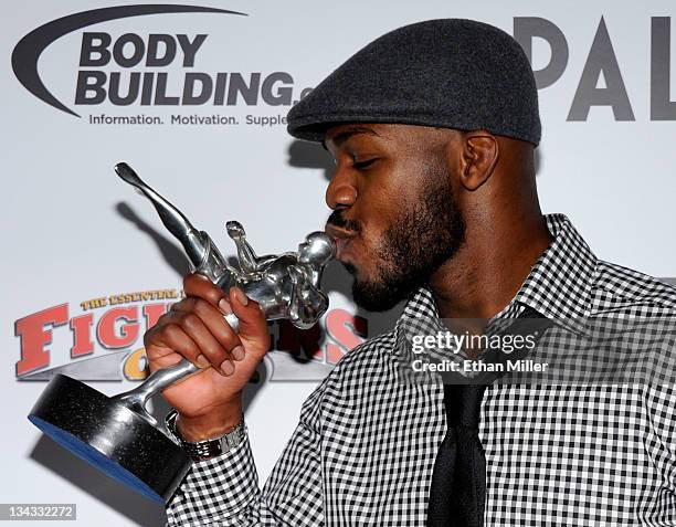 Mixed martial artist Jon Jones kisses his Fighter of the Year award at the Fighters Only World Mixed Martial Arts Awards 2011 at The Pearl concert...
