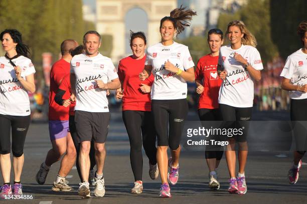 Samuel Etienne,Laury Thilleman and Alexandra Rosenfeld run the Paris Marathon 2011 for Mecenat Chirurgie Cardiaque on April 10, 2011 in Paris, France.