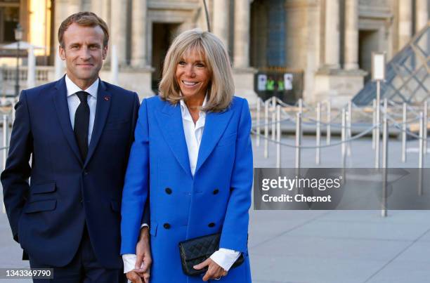 French President, Emmanuel Macron and his wife Brigitte Macon pose prior to the inauguration of the exhibition "Paris-Athens. Birth of Modern Greece...