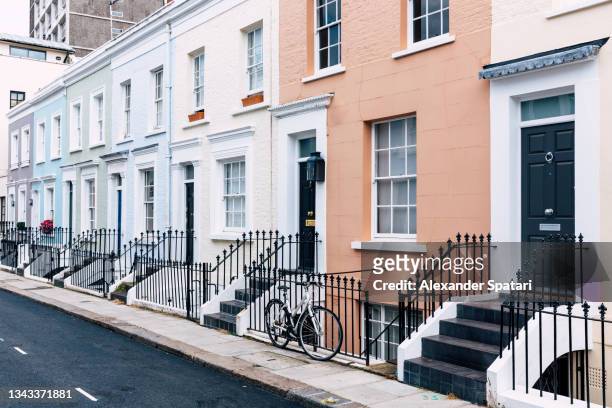 street in notting hill with residential row houses, london, uk - notting hill street stock pictures, royalty-free photos & images