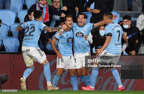 Denis Suarez of Celta Vigo celebrates with teammates after scoring their team's first goal during the LaLiga Santander match between RC Celta de Vigo...